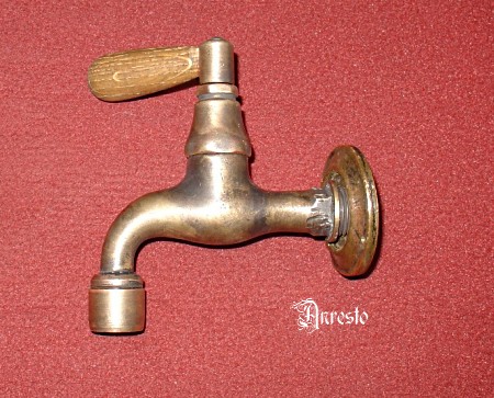 antique English wall tap with wooden lever